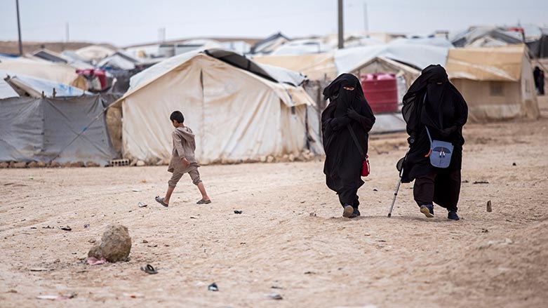 Women walk in the al-Hol camp that houses some 60,000 refugees, including families and supporters of the Islamic State group, many of them foreign nationals, in Hasakeh province, Syria, May 1, 2021. (Photo: Baderkhan Ahmad/ AP)