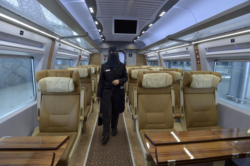 Saudi conductor Tharaa Ali, is pictured in one of the wagons of a high-speed train ferrying pilgrims to Mecca, in Saudi Arabia's Red Sea coastal city of Jeddah, Jan. 22, 2023. (Photo: Amer Hilabi/AFP)