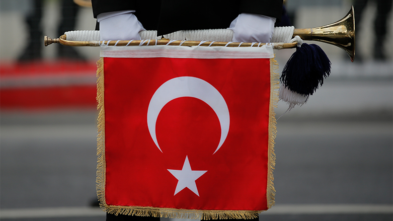 A Turkish soldier holds a trumpet with the Turkish flag as taking part in a parade during the celebration of Turkey's Republic Day in Istanbul. (Photo: Emrah Gurel/ AP)
