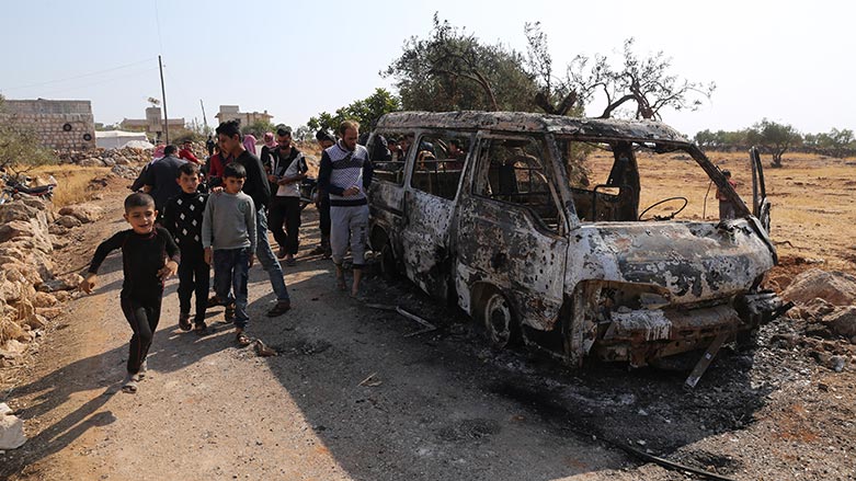 People look at a destroyed van near the village of Barisha, in Idlib province, Syria, Sunday, Oct. 27, 2019, after an operation by the U.S. military which targeted Abu Bakr al-Baghdadi. (Photo: Ghaith Alsayed/ AP)