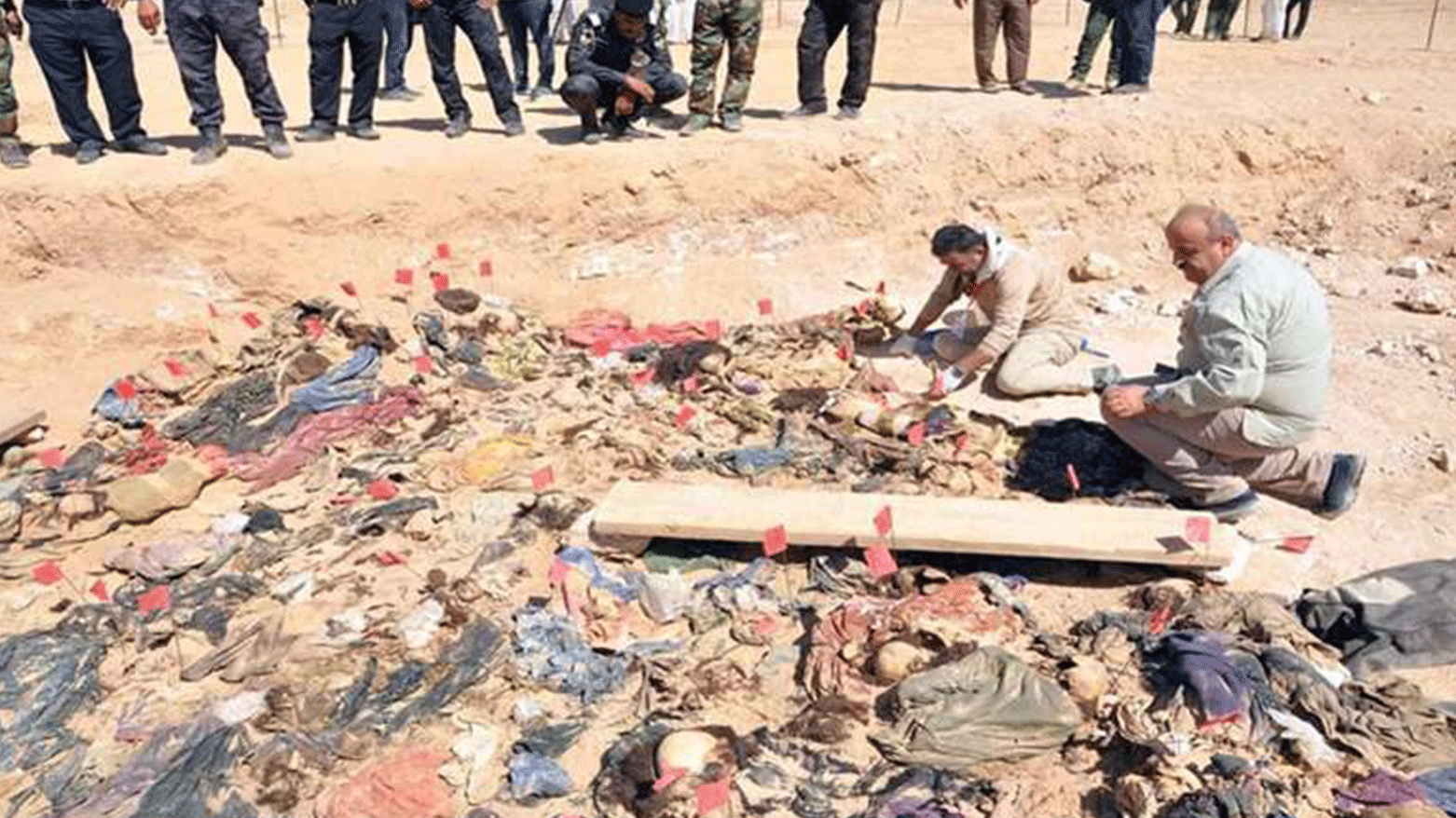 Forensics team inspects exhumed bodies of Anfal victims. (Photo: Kurdistan24)