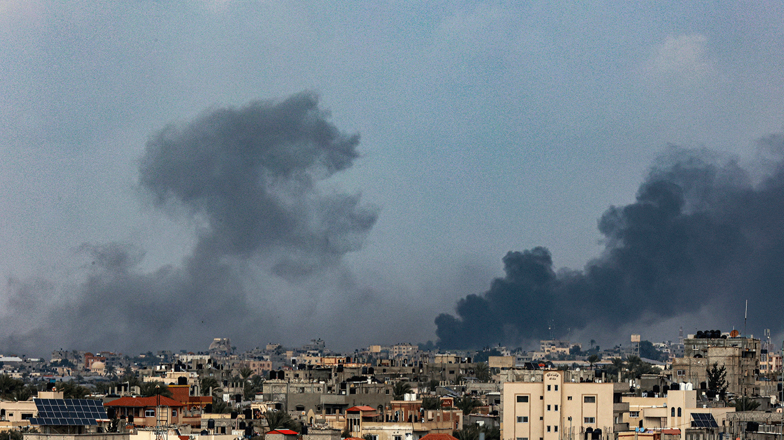 A picture taken from Rafah shows smoke billowing over Khan Yunis in the southern Gaza Strip during Israeli bombardment on January 14, 2024. (Photo: AFP)