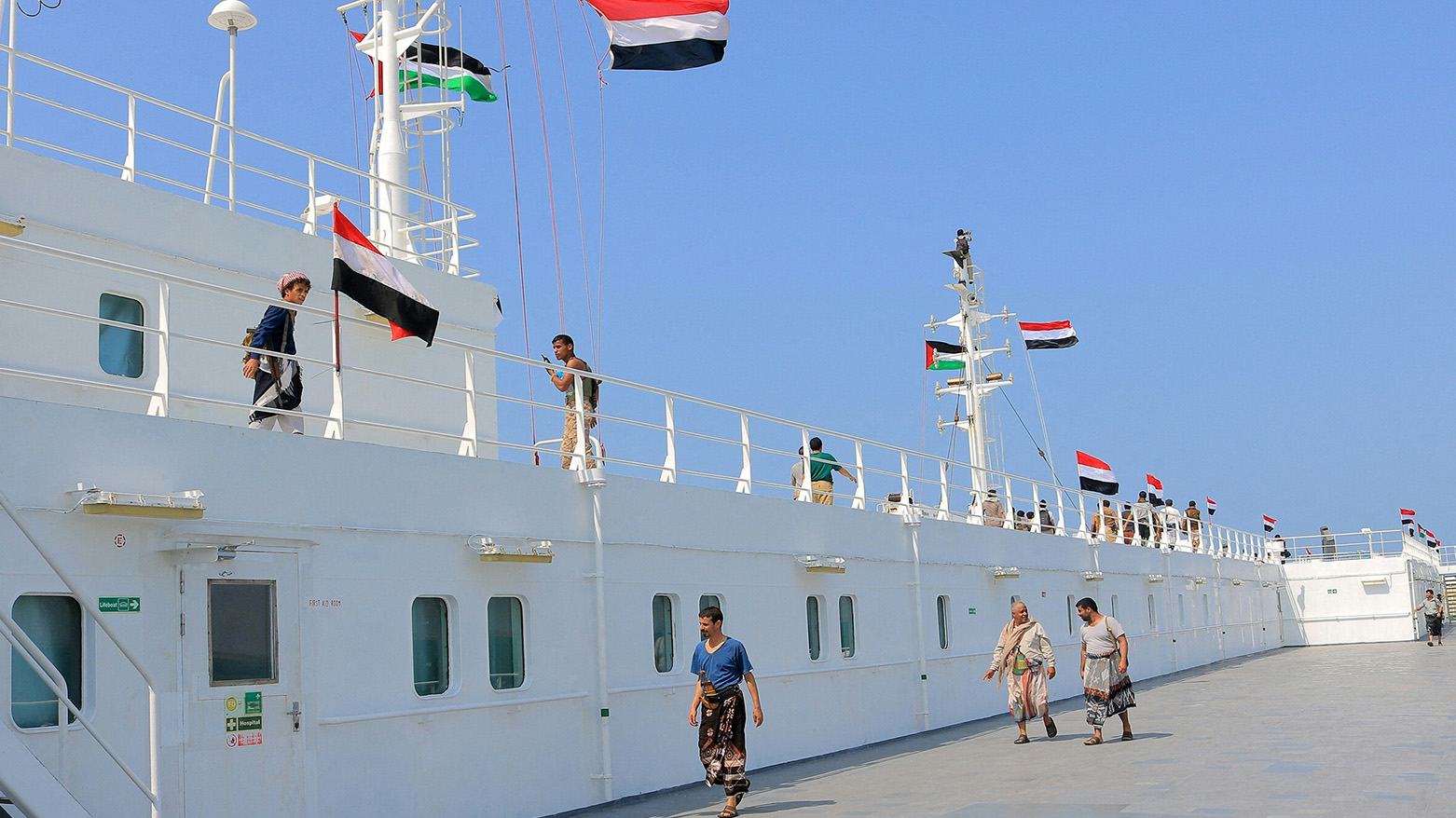 The Galaxy Leader cargo ship, seized by Huthi fighters two days earlier, docked in a port on the Red Sea in the Yemeni province of Hodeida, with Palestinian and Yemeni flags installed on it, Nov. 22, 2023 (Photo: AFP)