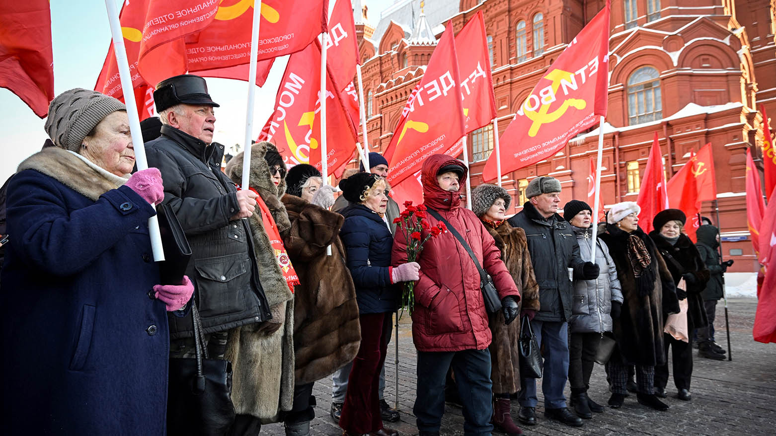 Russian communist supporters gather before a flower-laying ceremony at the mausoleum of the founder of the Soviet state, Vladimir Lenin, to mark the 100th anniversary of his death, in Moscow on January 21, 2024.