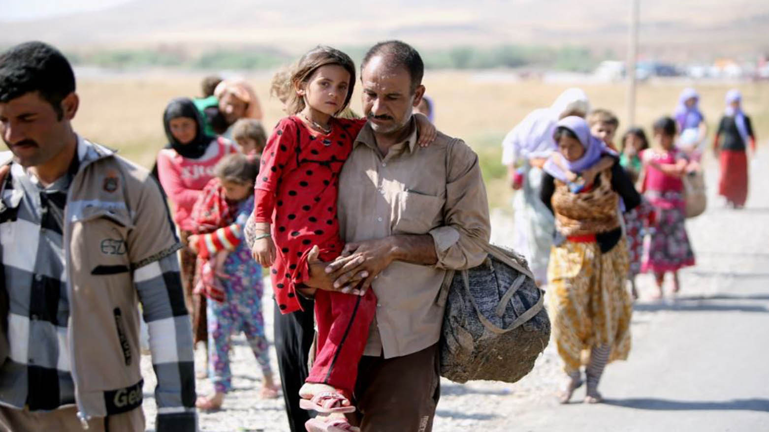 Yazidis flee Sinjar on Aug. 11, 2014. (Photo: AHMAD AL-RUBAYE / AFP-Getty)