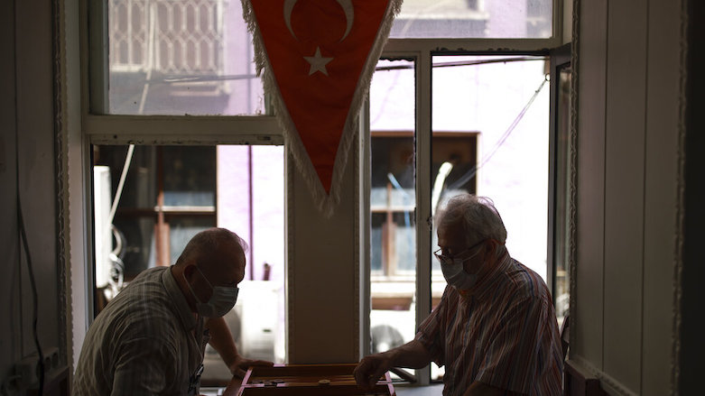 People play cards in a coffee shop in Istanbul, after Turkey's government eased coronavirus restrictions, July 1, 2021. (Photo: Emrah Gurel/AP)