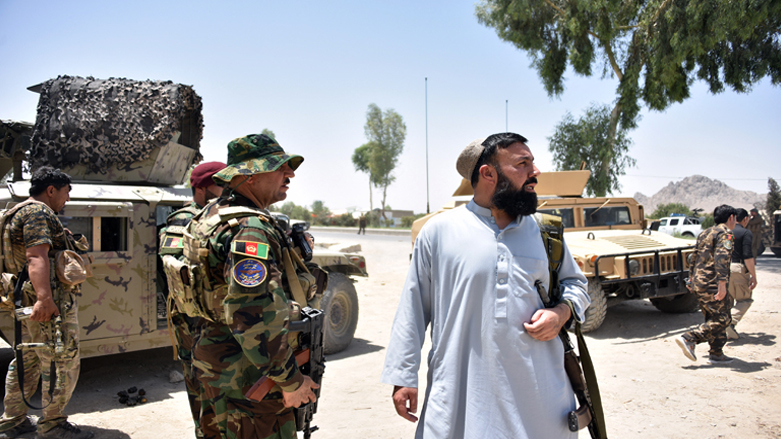 Afghan security personnel stand guard along the road amid ongoing fight between Afghan security forces and Taliban fighters in Kandahar,  July 9, 2021. (Photo: Javed Tanveer/AFP)