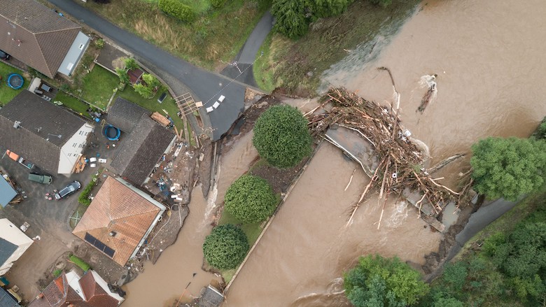 An aerial view taken on July 15, 2021 shows a bridge damaged by trunks following heavy rains and flood in Echtershausen, near Bitburg, western Germany. (Photo: Sebastien Bozon/AFP)