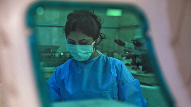 A medic analyses samples from COVID-19 patients at a hospital in Kurdistan Region’s city of Duhok, on July 27, 2021. (Photo: SAFIN HAMED/AFP)