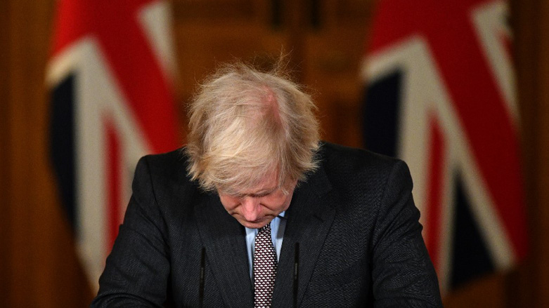Britain's Prime Minister Boris Johnson looks down at the podium as he attends a virtual press conference inside 10 Downing Street in central London, Jan. 26. 2021. (Photo: Justin Tallies/AFP)