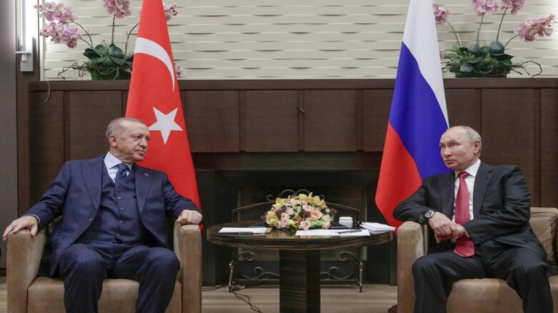 Russian President Vladimir Putin and Turkish President Recep Tayyip Erdogan talk to each other during their meeting in the Black Sea resort of Sochi, Russia, on Sept. 29, 2021 (Photo: Vladimir Smirnov, Sputnik, Kremlin Pool Photo via AP, Fi