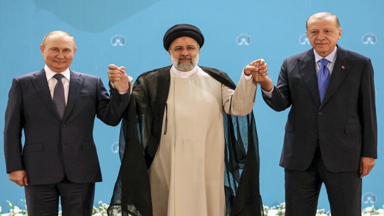 Russian President Vladimir Putin, left, Iranian President Ebrahim Raisi, center, and Turkish President Recep Tayyip Erdogan pose for a photo prior to their talks in Tehran, July 19, 2022 (Photo: Sergei Savostyanov, Sputnik, Kremlin Pool via