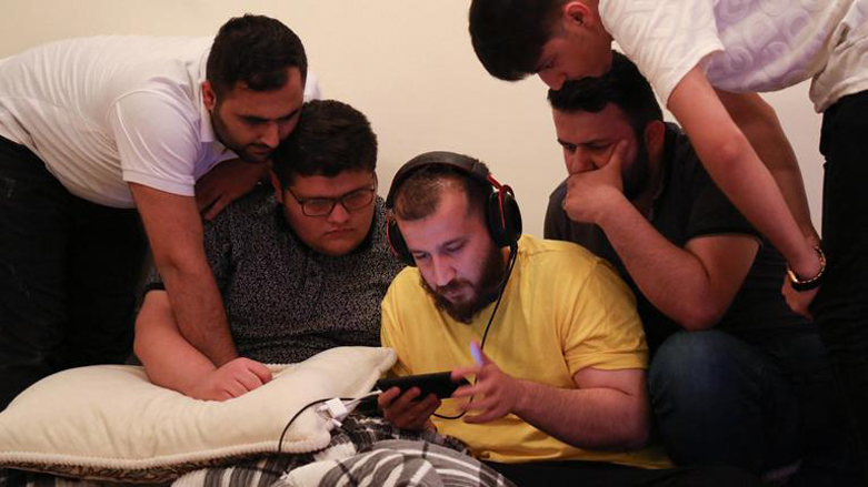A number of Kurdish virtual gamers are photographed watching a session of PUBG, May 1, 2021. (Photo: Safin Hamed/AFP)