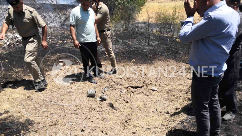 Residents and police survey the site where a drone crashed in the Kurdistan Region's Bamerne on July 28, 2022 (Photo: Submitted to Kurdistan 24)