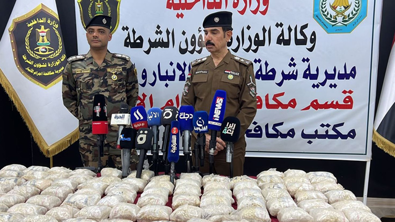 Members of the Iraqi security forces are pictured during a news conference announcing the confiscation of one million Captagon tablets in Anbar province, 2022. (Photo: Iraqi News Agency)