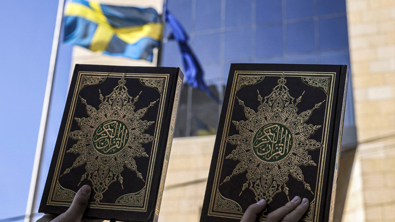 Palestinian protesters stand with copies of the Koran, Islam's holy book, during a demonstration outside the Swedish consulate headquarters in the East Jerusalem neighbourhood of Sheikh Jarrah, July 3, 2023. (Photo: Hazem Bader/AFP)