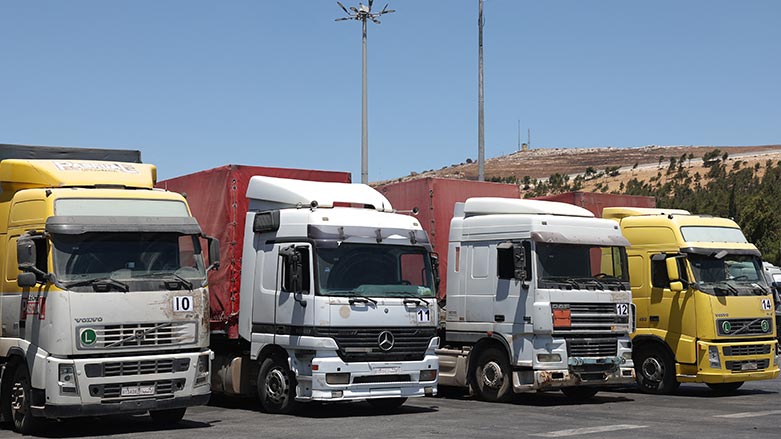 A convoy of trucks carrying humanitarian aid is seen parked after crossing the Syrian Bab al-Hawa border crossing with Turkey, on July 10, 2023. (Photo: Omar Haj Kadour/ AFP)