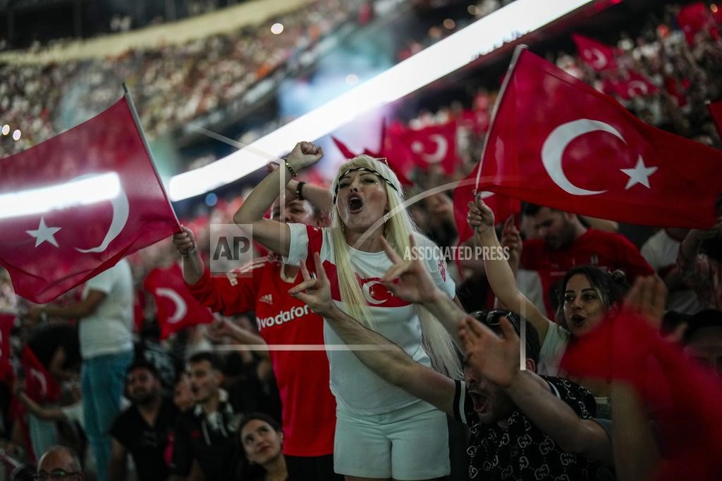 Turkish supporters celebrate the opening goal as they watch a quarterfinal match between Turkey and Netherlands. (Photo: AP)