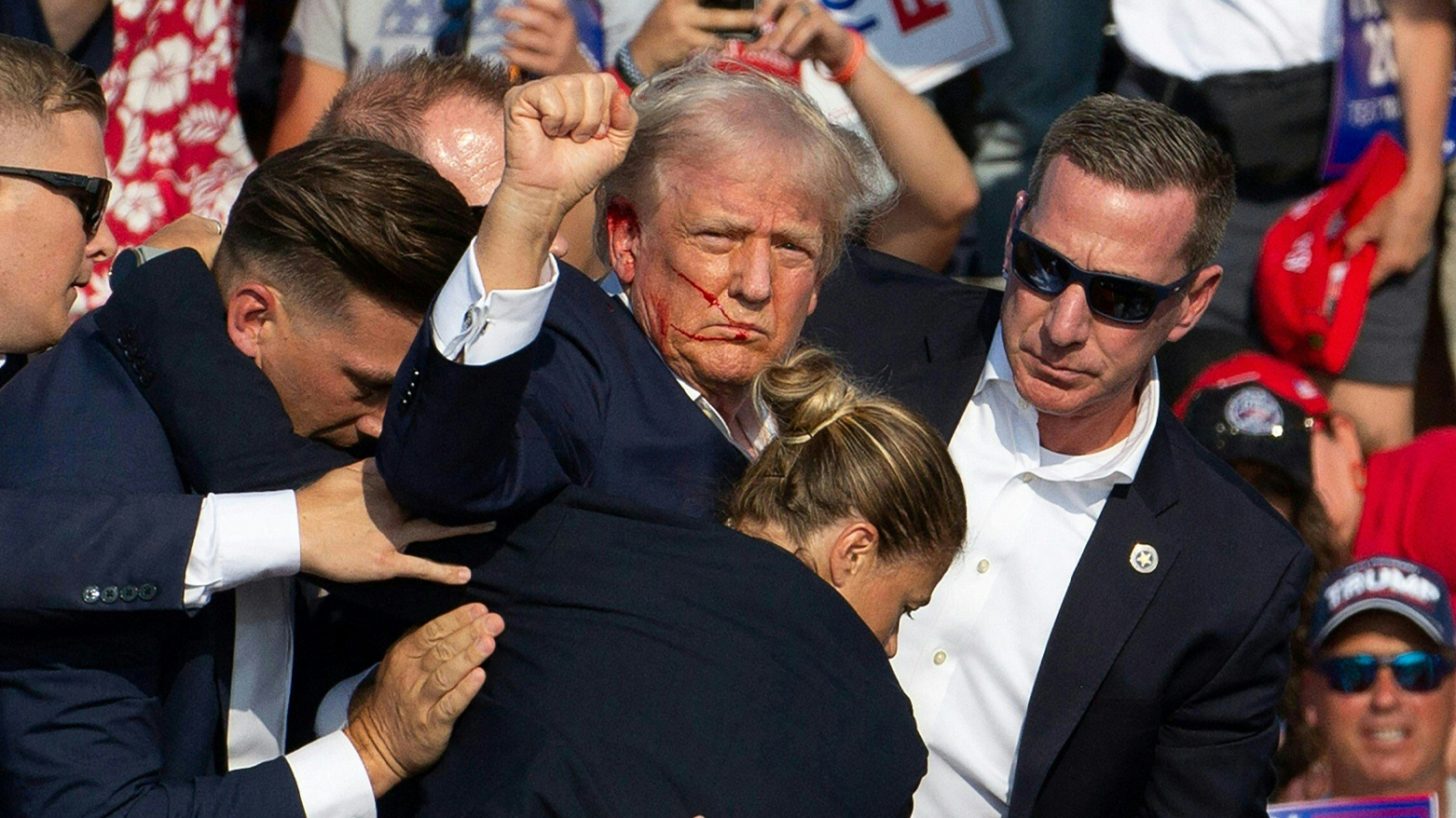 Bloodied Trump survives assassination attempt