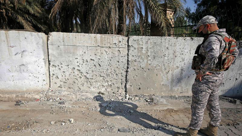 A member of the Iraqi security forces inspects the damage in the capital Baghdad after a volley of rockets slammed into the Iraqi capital, November 18, 2020. (Photo: Ahmad al-Rubaye/AFP)