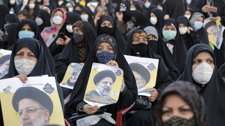 Female supporters of Iranian presidential candidate Ebrahim Raisi hold up his posters during a campaign rally in Eslamshahr, about 25 km south of Tehran, June 6, 2021. (Photo: AFP)