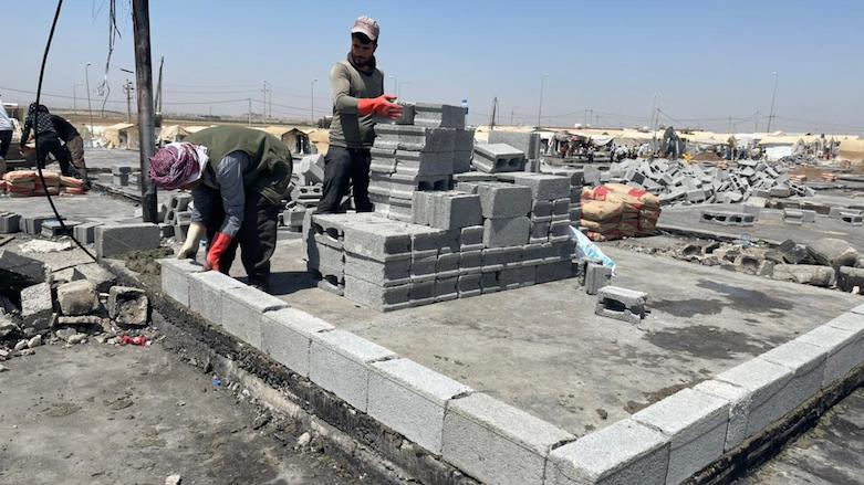 Volunteers began rebuilding the Sharya IDP camp for Yezidis in Duhok province after hundreds of shelters were destroyed by a fire, June 11, 2021. (Photo: Masoud Mohammad/Kurdistan 24)