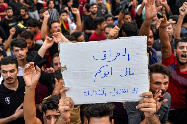 Demonstrators during a protest against government corruption in Iraq's capital Baghdad. (Photo: Haidar Hamdani/AFP)