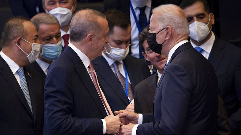 Turkey’s President Recep Tayyip Erdogan, center left, greets US President Joe Biden, center right, during a plenary session during a summit at NATO headquarters in Brussels, Belgium, June 14, 2021. (Photo: Brendan Smialowski/Pool/AP)