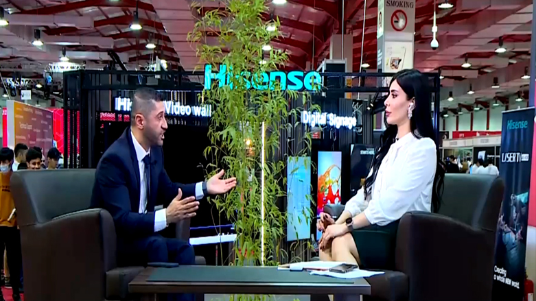 Hiwa Afandi, head of the KRG's Department of Information Technology (left) speaks during an interview with Kurdistan 24 at the 2021 HITEX fair in Erbil, June 16, 2021. (Photo: Kurdistan 24)