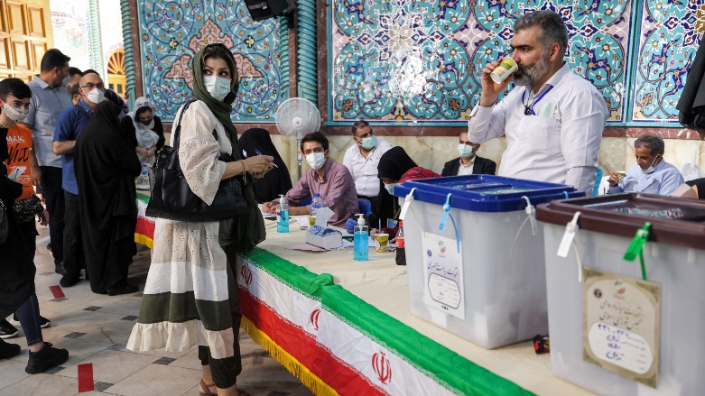 A woman arrives to vote at a polling station polling station in Iran's capital Tehran on June 18, 2021, during the 2021 presidential election. ( Photo: Atta Kenare / AFP )