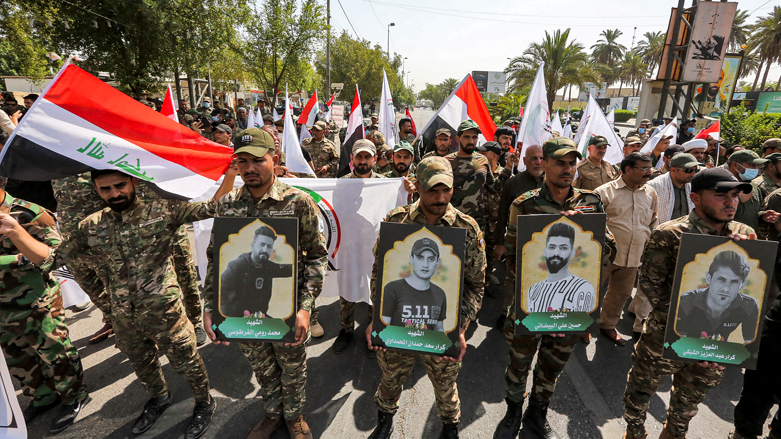 Members of Iraq's Hashed al-Shaabi (Popular Mobilisation) paramilitary forces march in a symbolic funerary parade in the capital Baghdad, June 29, 2021. (Photo: Sabah Arar/AFP)