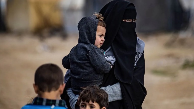 Women and children are pictured at the Kurdish-run al-Hol camp on February 17, 2021 (Photo: Delil Souleiman/AFP)