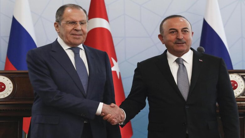 Russian Foreign Minister Sergei Lavrov, left, and Turkish Foreign Minister Mevlut Cavusoglu shake hands at the end of a joint news conference in Ankara, Wednesday, June 8, 2022. (Photo: Burhan Ozbilici/AP)