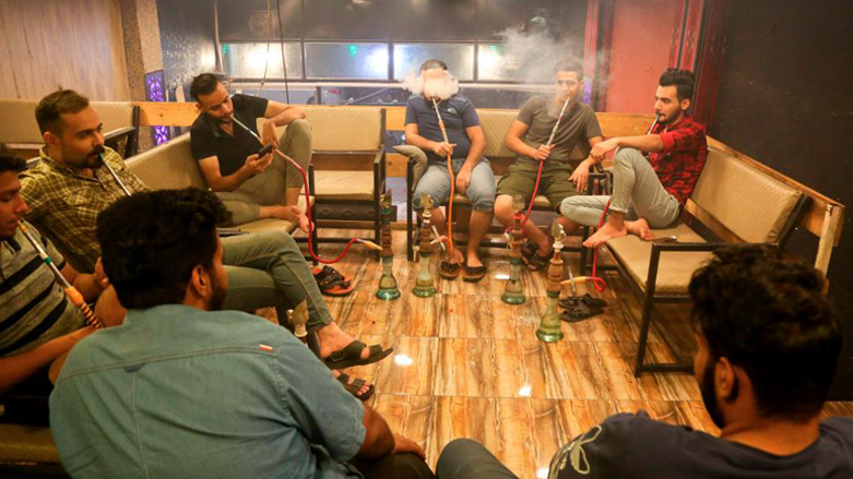 Iraqi men smoke shisha at a cafe in the southern city of Karbala, Oct. 21, 2020. (Photo: Mohammed Sawaf/AFP)