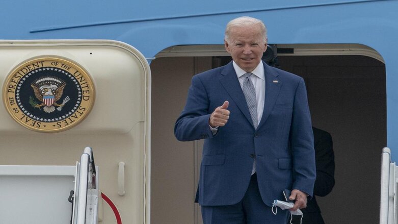 President Joe Biden gestures as he boards Air Force One at Andrews Air Force Base, Md., June 14, 2022 (Photo: Gemunu Amarasinghe/AP)