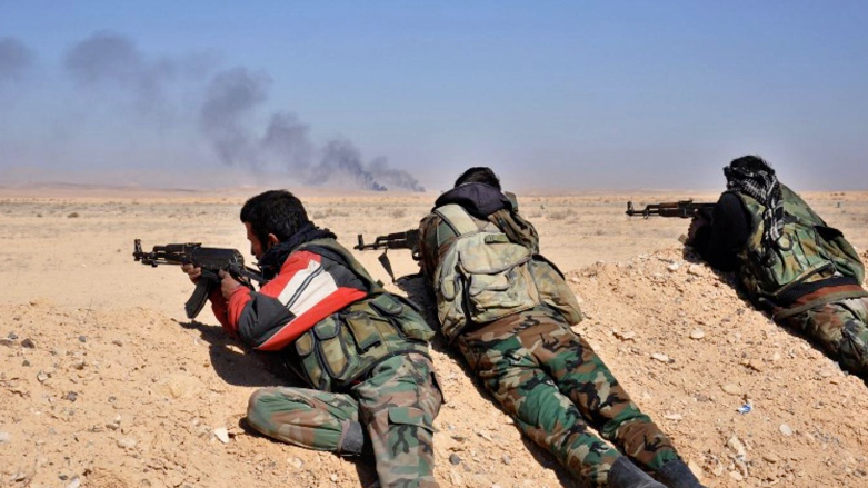 Syrian government forces fire toward ISIS positions in Homs province (Photo: AFP/file photo)