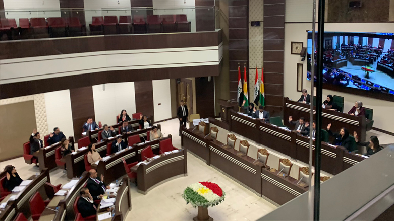 Lawmakers in the Kurdistan Parliament raising their hands to vote for the establishment of the Kurdistan Accrediting Association for Education (KAAE), June 22, 2022 (Photo: Courtesy of Honar Issa)