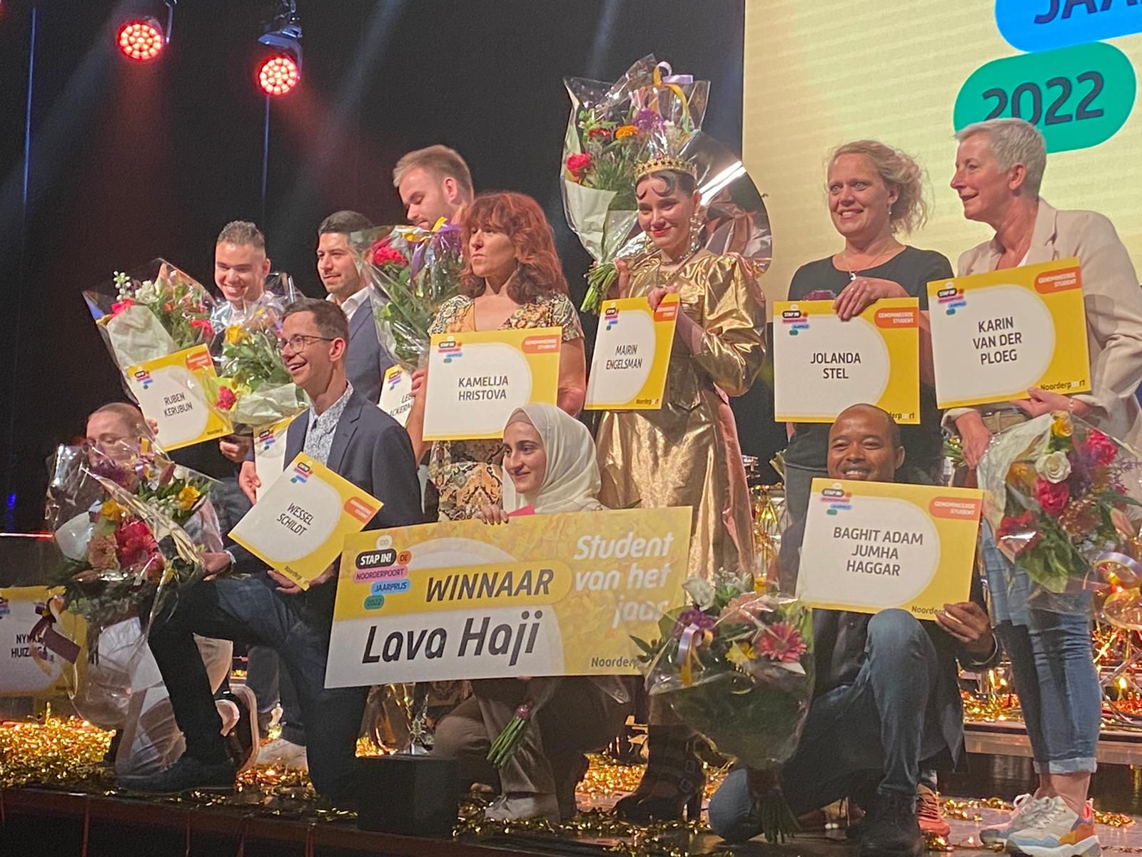 Lava Haji (in headscarf) holds a placard declaring her the Netherland's 2022 Student of the Year, May 2022. (Photo: Courtesy of Lava Haji)