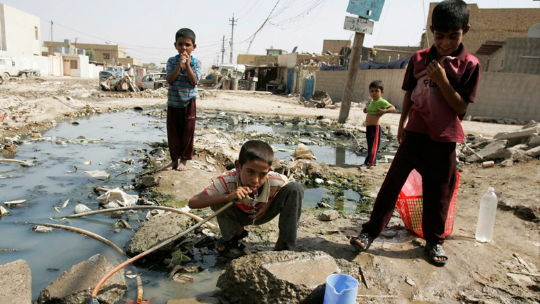A kid is seen drinking water from a broken pipe in Baghdad's Sadr City. (Photo: AP)