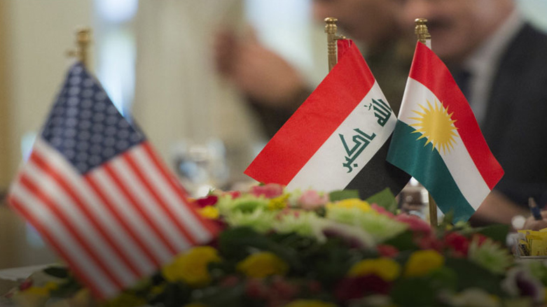 Iraqi and Kurdistan Region flags (right) placed next to US flag at a meeting between Kurdistan Region and American officials. (Photo: AFP)