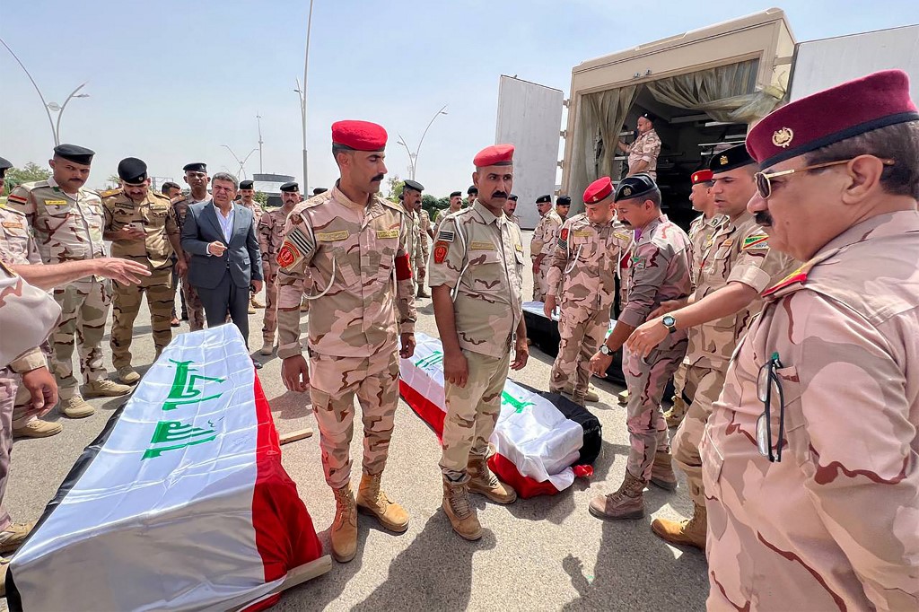 The bodies of three Iraqi soldiers who were killed in a pre-dawn attack blamed on the Islamic State group, are repatriated from Kirkuk airport in northern Iraq, June 11, 2023. (Photo: Marwan Ibrahim/AFP)