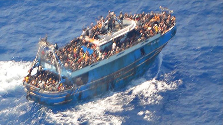 An aerial view taken from a rescue helicopter, of migrants onboard a fishing vessel in the waters off the Peloponnese coast of Greece on June 13, 2023. (Photo: The Hellenic Coastguard/ AFP)