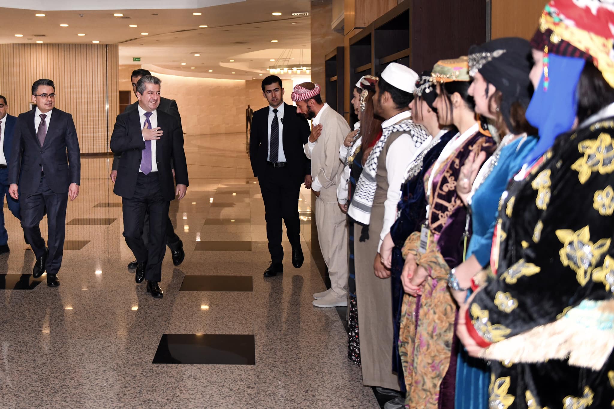 Members of different religious and ethnic communities greet Prime Minister Masrour Barzani on the sidelines of a conference on the Interantional Day for Countering Hate Speech in Erbil, June 18, 2023. (Photo: KRG)