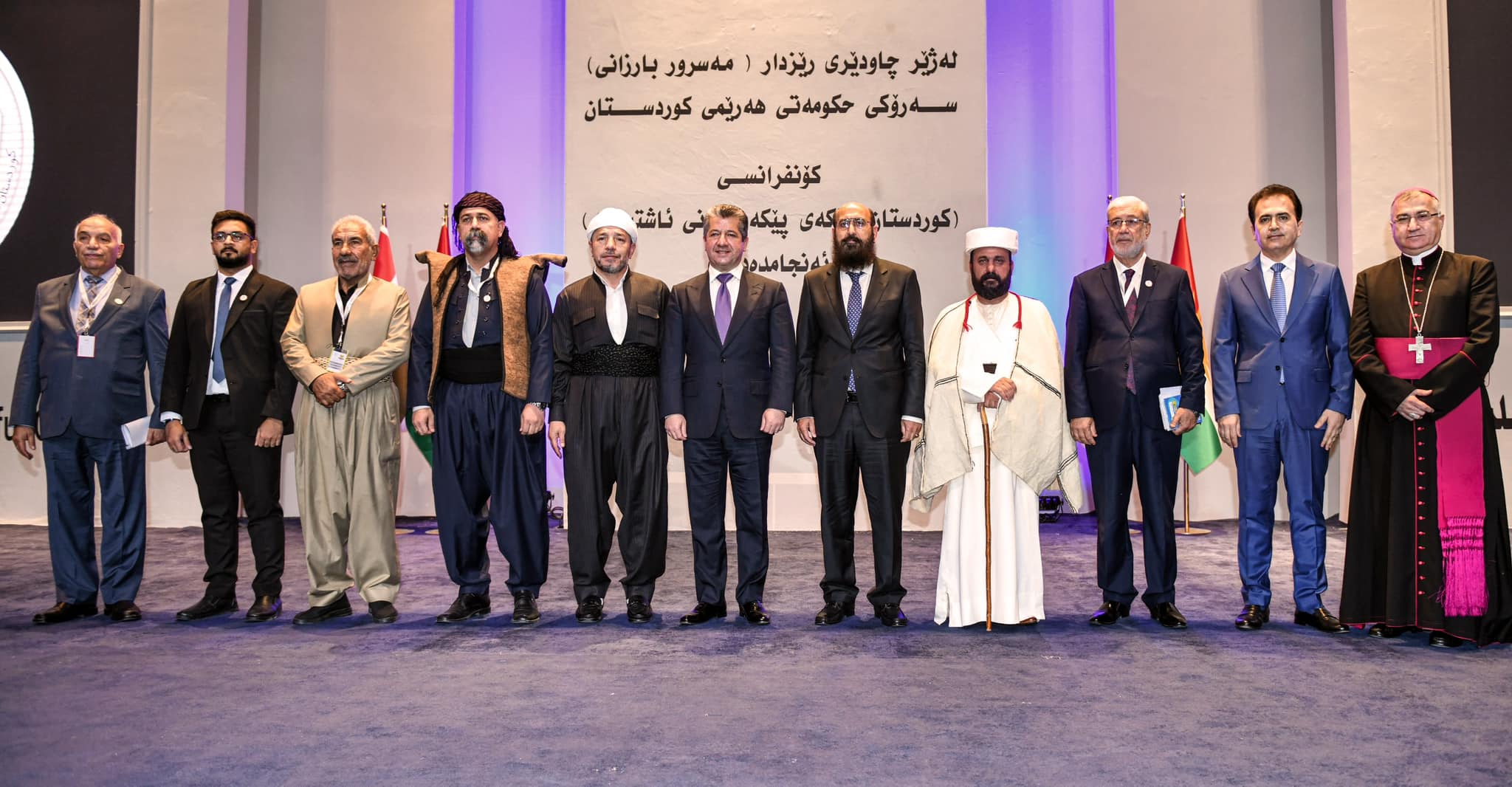 Kurdistan Region Prime Minister Masrour Barzani (sixth from right) posing for a group photo with various leaders of religious community in Erbil at the Kurdistan: Cradle of Peaceful Coexistence conference in Erbil, June 18, 2023. (KRG)