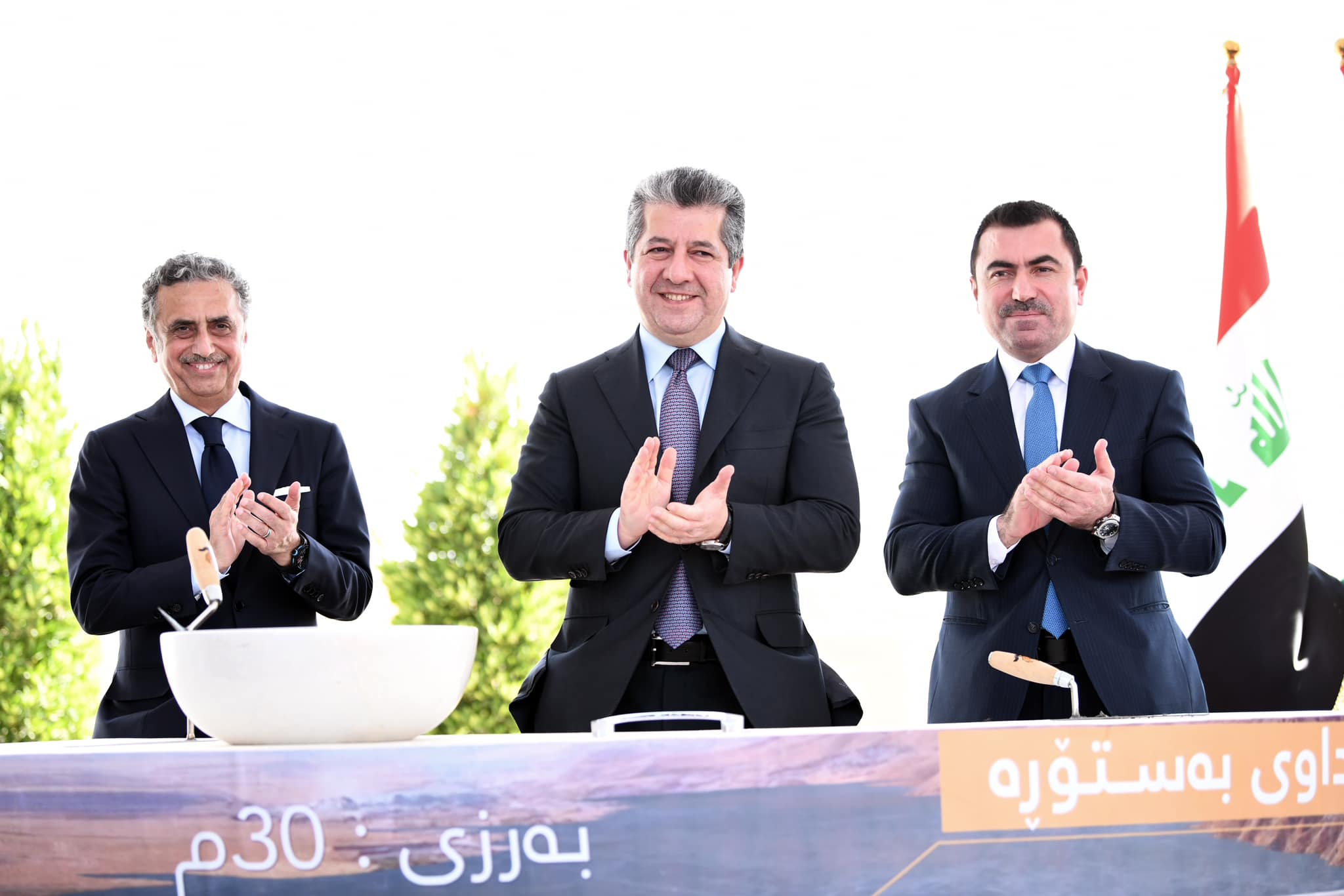 Kurdistan Region Prime Minister Masrour Barzani (center) clapping after laying the foundation stone of Bastora Dam in Erbil, June 24, 2023. (Photo: KRG)