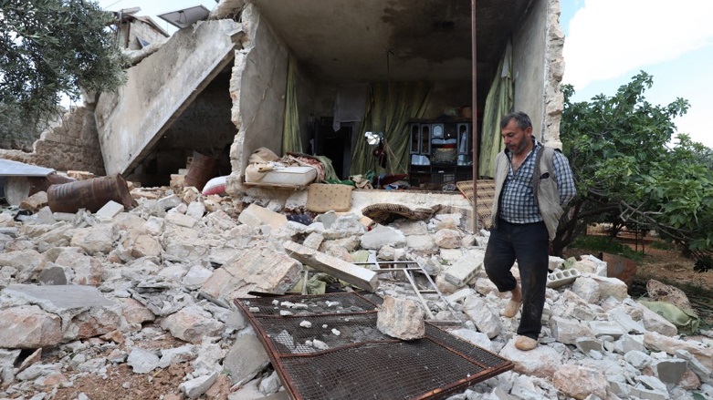 A man walks on the rubble of a damaged house following reported Russian air raids on the outskirts of Syria's rebel-held northwestern city of Idlib, on June 20, 2023 (Photo: Abdulaziz Ketaz/AFP)