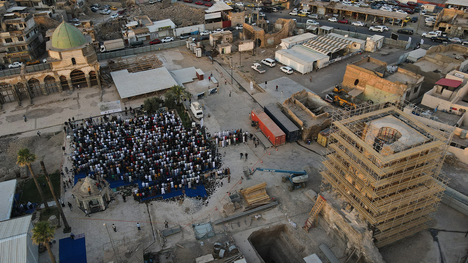 This aerial view shows Muslims gathered to pray in the courtyard of the Al-Nuri mosque in the northern Iraqi city of Mosul, during the Eid al-Adha holiday, on July 9, 2022. (Photo: Zaid AL-OBEIDI / AFP)