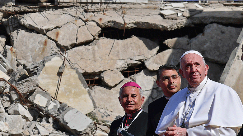 Pope Francis (R), looks on at a square near the ruins of the Syriac Catholic Church of the Immaculate Conception (al-Tahira-l-Kubra), in the old city of Iraq's northern Mosul, March 7, 2021. (Photo: Vincenzo Pinto/AFP