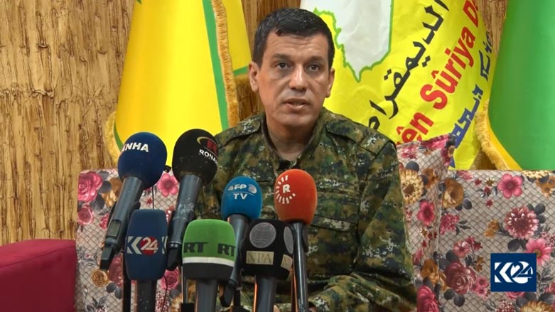 SDF Commander-in-Chief Mazloum Abdi speaks to reporters during a press conference in Oct. 2019 (Photo: Archive/Kurdistan 24)