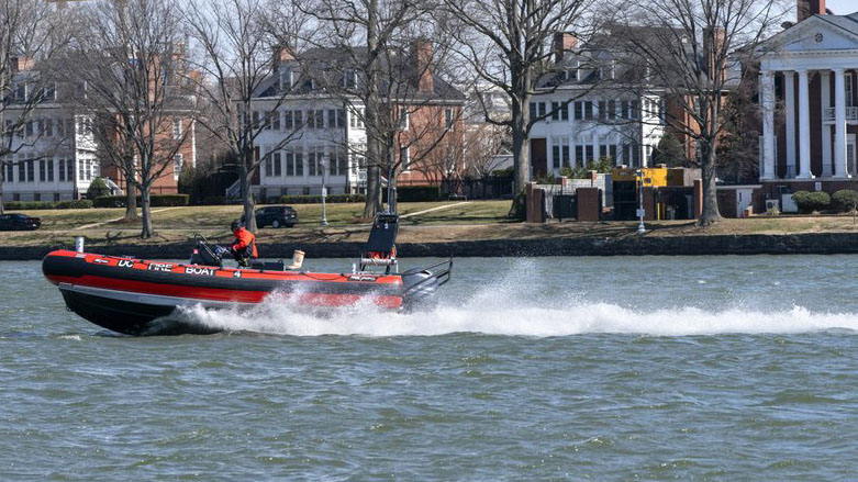 Photo a District of Columbia Fire Boat checks buoys in the waterway next to Fort McNair, seen in background in Washington, March 19, 2021. (Photo: AP Photo/Jacquelyn Martin)